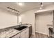 Modern kitchen featuring granite countertops and stainless steel appliances at 2880 S Locust St # 704N, Denver, CO 80222