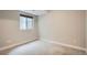 Spacious basement bedroom with carpeted floor and a window at 2804 W 53Rd Ave, Denver, CO 80221