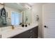 Well-lit bathroom with double sink vanity, modern fixtures, and a clean, minimalist design at 2804 W 53Rd Ave, Denver, CO 80221