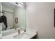 Modern half bathroom featuring a quartz countertop, sleek fixtures, and contemporary decor at 2804 W 53Rd Ave, Denver, CO 80221