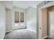 Bright bedroom with carpet flooring, large windows with blinds, and a neutral color palette at 2804 W 53Rd Ave, Denver, CO 80221