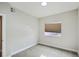 Simple bedroom with carpet and a window with blinds at 2804 W 53Rd Ave, Denver, CO 80221