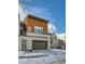 Modern two-story townhome with wood siding and attached garage at 2804 W 53Rd Ave, Denver, CO 80221