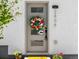 Charming front door with a decorative wreath, stylish hardware, and neatly landscaped entrance at 2804 W 53Rd Ave, Denver, CO 80221
