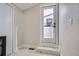 Laundry room with exterior access and white tile flooring at 2804 W 53Rd Ave, Denver, CO 80221