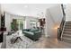 Bright, open-concept living area featuring modern furnishings and sliding glass doors at 2804 W 53Rd Ave, Denver, CO 80221