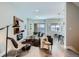 Bright and airy living room featuring modern furniture, wood floors, and an open layout to the kitchen at 2804 W 53Rd Ave, Denver, CO 80221