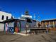 Outdoor view of a restaurant with a rooftop sign and mural in daytime at 2804 W 53Rd Ave, Denver, CO 80221