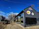 Street view of brick retail building with dark trim and street parking at 2804 W 53Rd Ave, Denver, CO 80221