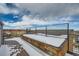 Rooftop deck with snow, wood planter boxes, and city views at 2804 W 53Rd Ave, Denver, CO 80221