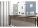 Private balcony offers views of neighboring buildings and a secure railing at 2680 Blake St # 12, Denver, CO 80205