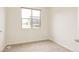 Bedroom features neutral carpeting and bright natural light at 2680 Blake St # 12, Denver, CO 80205