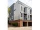 Contemporary exterior view of townhome with brick and metal facade at 2680 Blake St # 12, Denver, CO 80205