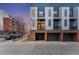 Modern townhouse with a blue and silver facade, brick accents and garage parking at 2680 Blake St # 12, Denver, CO 80205