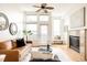 Bright and airy living room boasts a fireplace, hardwood floors and large windows at 2680 Blake St # 12, Denver, CO 80205