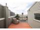 Relax on this rooftop deck, complete with stylish seating and neighborhood views at 2680 Blake St # 12, Denver, CO 80205