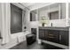 A modern bathroom features dark herringbone tile, black fixtures, and white tiling in shower at 891 14Th St # 2914, Denver, CO 80202