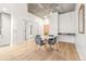 Dining room with modern chandelier and seating for four at 891 14Th St # 2914, Denver, CO 80202