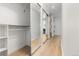 Hallway with closet, wood floors and neutral paint scheme at 891 14Th St # 2914, Denver, CO 80202