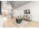 Bright living room boasts an open concept, concrete ceiling, modern furnishings, and natural wood flooring at 891 14Th St # 2914, Denver, CO 80202