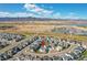 Aerial view of the homes in the neighborhood overlooking the mountains in the distance at 11269 Star Streak Rd, Littleton, CO 80125