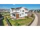 Aerial view of a home's backyard with a covered patio and solar panels on the roof at 11269 Star Streak Rd, Littleton, CO 80125