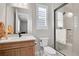 Bright bathroom features modern fixtures, a sleek vanity, and a frameless glass shower enclosure at 11269 Star Streak Rd, Littleton, CO 80125