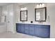 Elegant bathroom featuring dual vanities, stylish mirrors, and sleek hardware at 11269 Star Streak Rd, Littleton, CO 80125