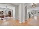 Open-concept floor plan with hardwood floors connecting the office and living area at 11269 Star Streak Rd, Littleton, CO 80125