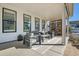Spacious covered patio with elegant outdoor furniture, ideal for relaxing and entertaining at 11269 Star Streak Rd, Littleton, CO 80125