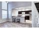 Modern kitchen with dark cabinetry and breakfast bar at 8232 W 90Th Pl, Broomfield, CO 80021