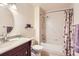 Bathroom featuring a bathtub, toilet, sink, and vanity with granite countertop at 1470 S Quebec Way # 46, Denver, CO 80231