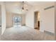 Bright bedroom with vaulted ceilings, a ceiling fan, and a private balcony at 1470 S Quebec Way # 46, Denver, CO 80231