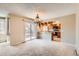 Dining room area with chandelier and sliding door access to an outdoor deck at 1470 S Quebec Way # 46, Denver, CO 80231