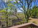 Charming townhouse exterior featuring mature trees and a glimpse of mountain views from a private balcony at 1470 S Quebec Way # 46, Denver, CO 80231