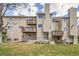 Exterior of building showing multiple balconies, patios, and grassy lawn at 1470 S Quebec Way # 46, Denver, CO 80231