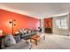 Bright living room featuring a cozy fireplace and a comfortable seating area at 1470 S Quebec Way # 46, Denver, CO 80231