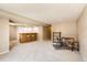 Finished basement rec room featuring a wet bar, neutral carpeting, and plenty of space at 1470 S Quebec Way # 46, Denver, CO 80231
