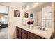 Bright bathroom features a double vanity, large mirror and stylish decor at 24416 E Powers Ave, Aurora, CO 80016