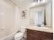 Well-lit bathroom with shower-tub combo and vanity with ample counter space at 24416 E Powers Ave, Aurora, CO 80016