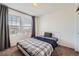 Bedroom with neutral carpet, natural light and simple furnishings at 24416 E Powers Ave, Aurora, CO 80016