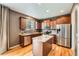 Modern kitchen featuring stainless steel appliances, granite countertops, and ample cabinet space at 24416 E Powers Ave, Aurora, CO 80016