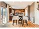 Kitchen area featuring a table for four, wood cabinets and stainless appliances at 24416 E Powers Ave, Aurora, CO 80016