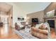 Cozy living room with plush seating, fireplace, and warm neutral tones, creating an inviting atmosphere at 24416 E Powers Ave, Aurora, CO 80016