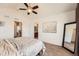 The main bedroom features carpet, a fan, and doorways to an ensuite and closet at 24416 E Powers Ave, Aurora, CO 80016