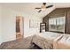 Inviting main bedroom with an ensuite bathroom access boasts natural light and a ceiling fan at 24416 E Powers Ave, Aurora, CO 80016