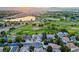 Beautiful aerial view overlooking a golf course, lake, and stunning homes at 4121 S Allison St, Denver, CO 80235