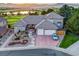 Aerial view showcasing the home's grand entrance, water feature, and spacious driveway at 4121 S Allison St, Denver, CO 80235