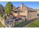 Backyard oasis with a waterfall feature, patio, and hot tub at 4121 S Allison St, Denver, CO 80235