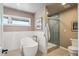 Luxurious bathroom features a soaking tub, a walk-in shower, and neutral wall colors at 4121 S Allison St, Denver, CO 80235